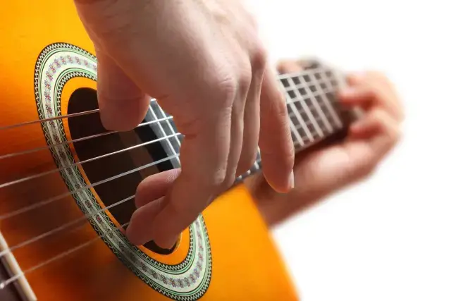 Facilitator playing guitar during an ayahuasca ceremony in the Algarve